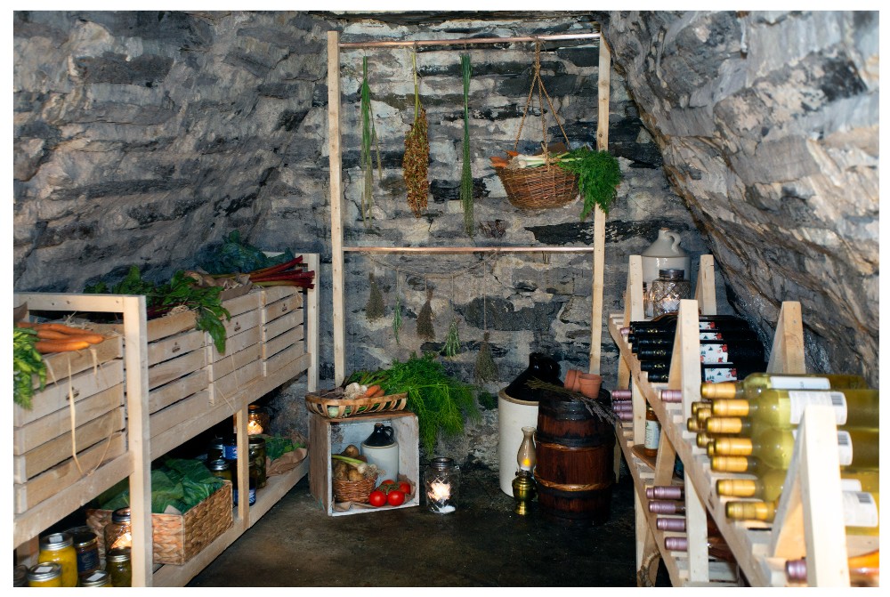 Root cellar filled with vegetables and jars