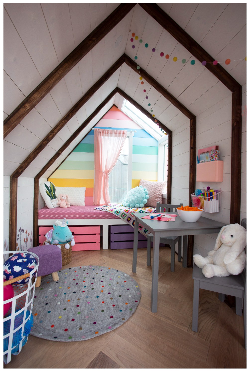 Colourful playhouse with rainbow decor