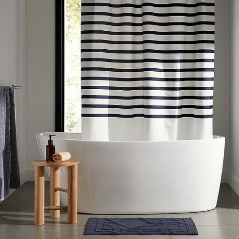 A blue and white striped shower curtain