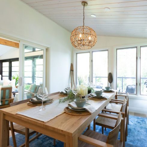 Renovated beach themed dining room overlooking lake