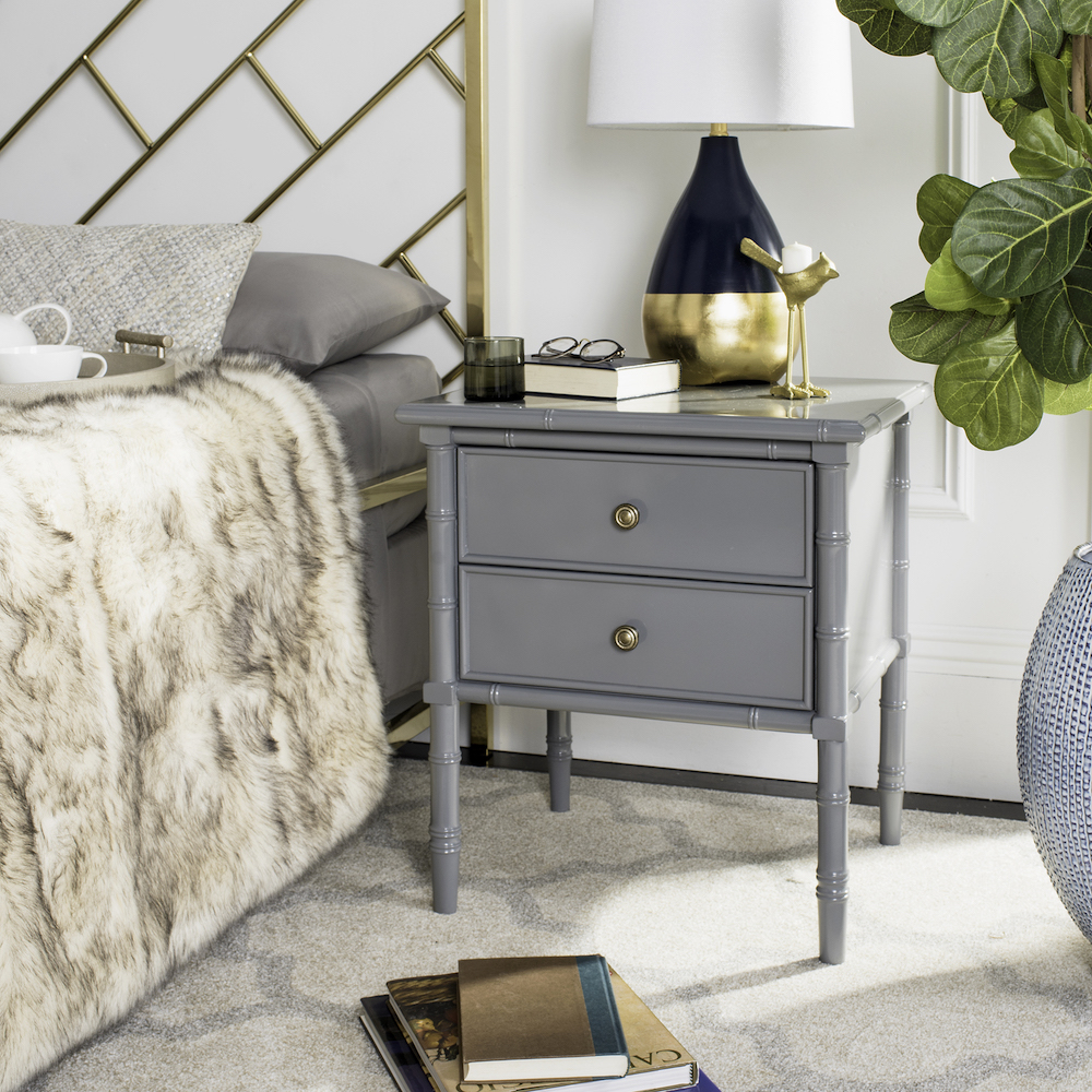 Small grey nightstand with spooled legs in bedroom