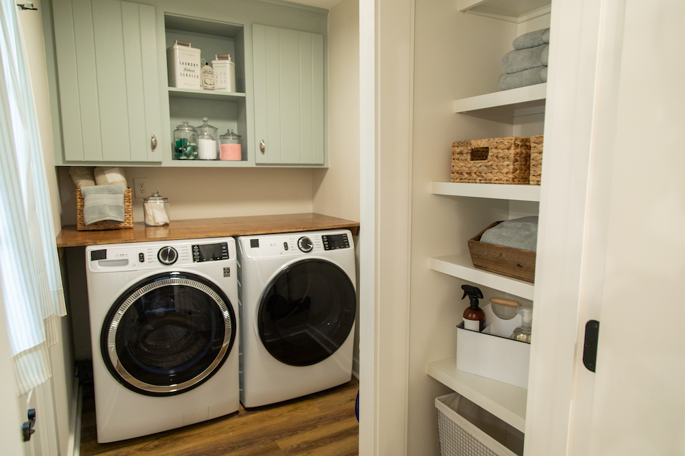 Renovated laundry room with folding table
