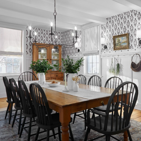 Dining room with black and white stencil design on walls