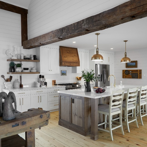 A crisp white kitchen with rustic wood touches and exposed beams