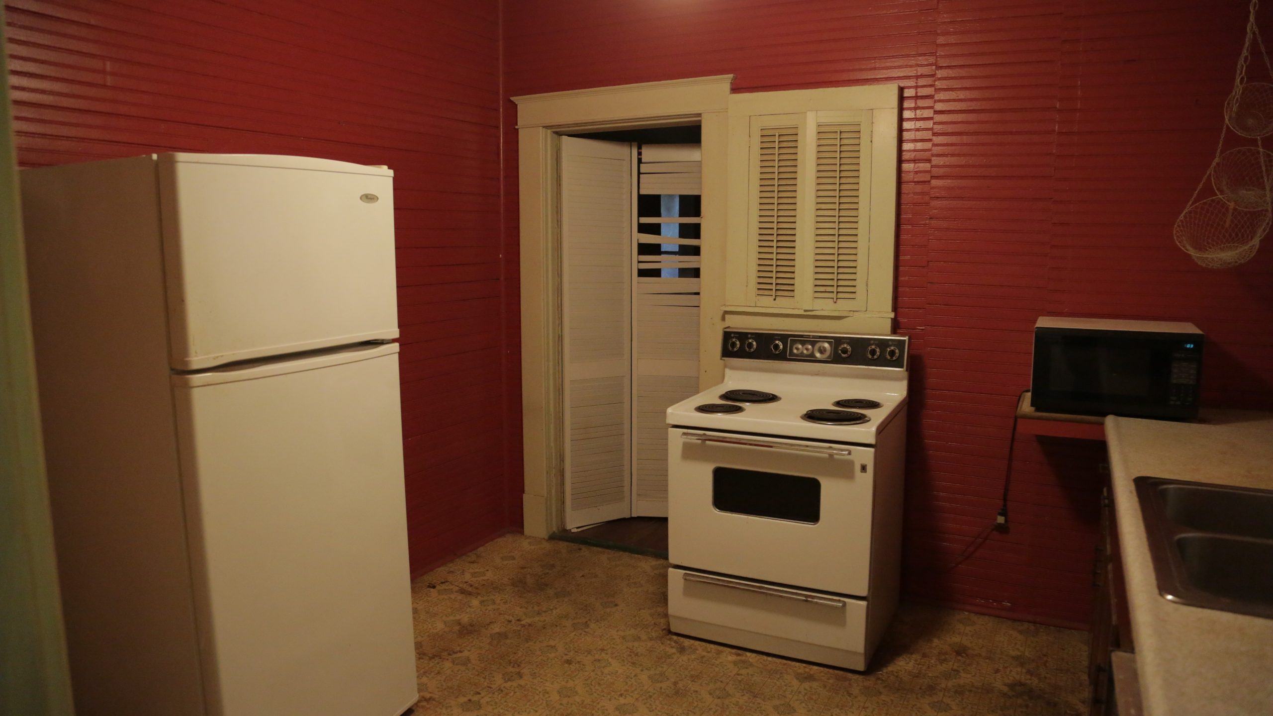 Outdated maroon kitchen