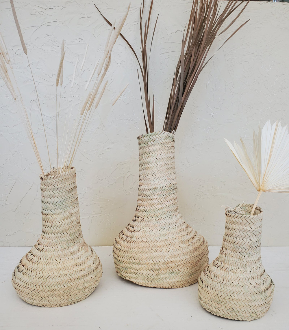 Vases made of natural woven palm leaves