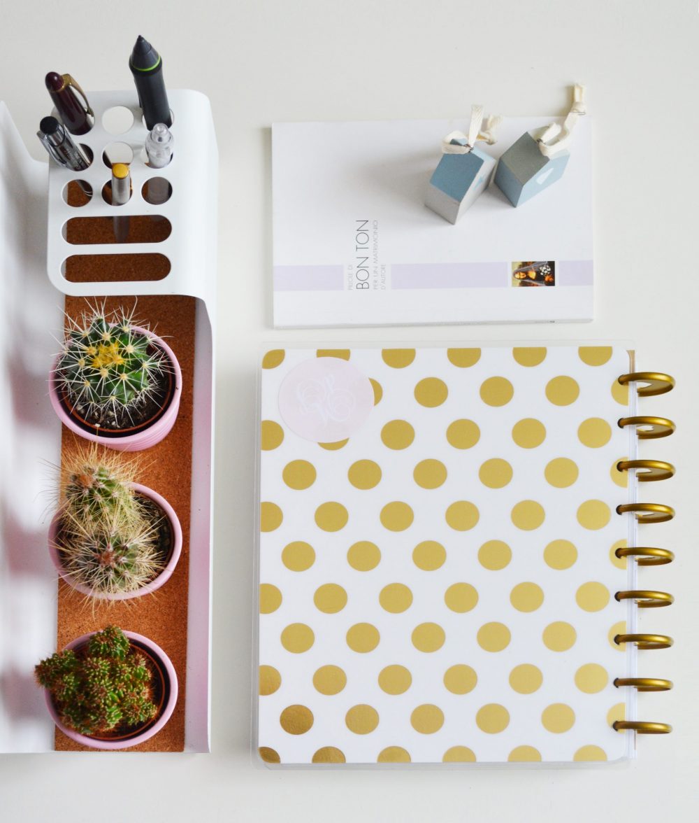 Compartmentalized stationary and decor on top of organized desk