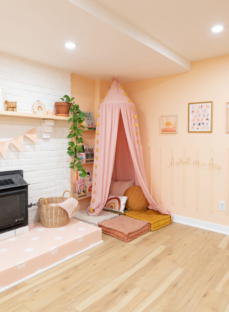 pink reading nook in basement