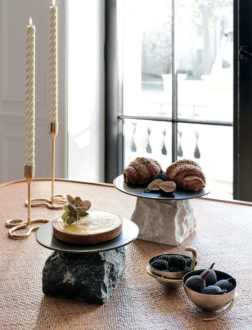Luxurious tabletop items including candle holders and serving vessels