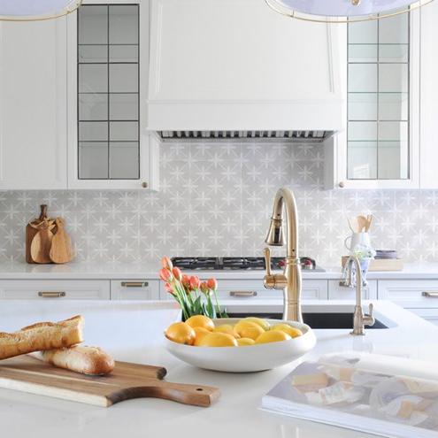 Bright white kitchen with patterned tile backsplash