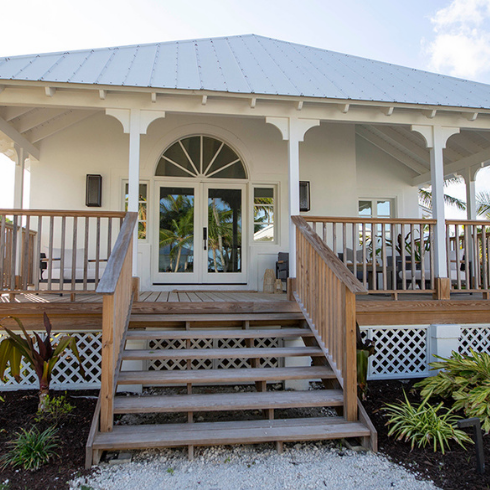 Exterior of white Bahamian villa at Caerula Mar Club
