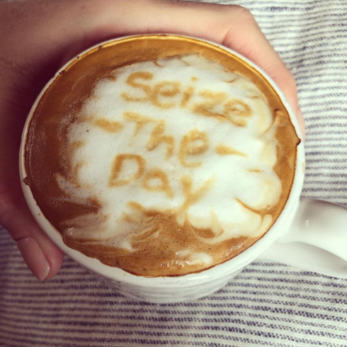 Latte art with inspiring quote that reads seize the day
