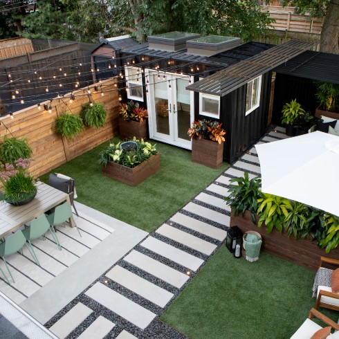 Urban backyard makeover with shipping container shed