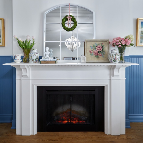 Electric fireplace with vintage upcycled mantel in French country style