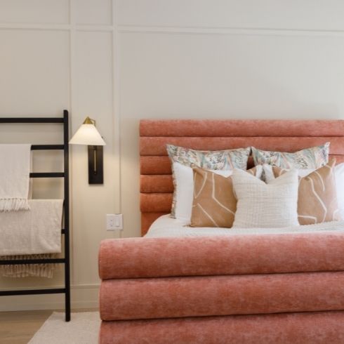 modern minimalist white bedroom with pink headboard and white bed