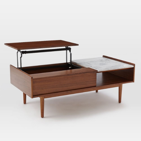 West Elm Mid-Century Pop-Up Storage Coffee Table with desk leaf lifted into the air set on a white background