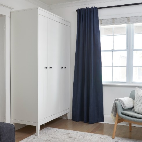 Entryway cabinet and navy blue curtains