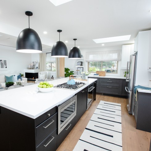 Contemporary kitchen island with black drum pendant lights