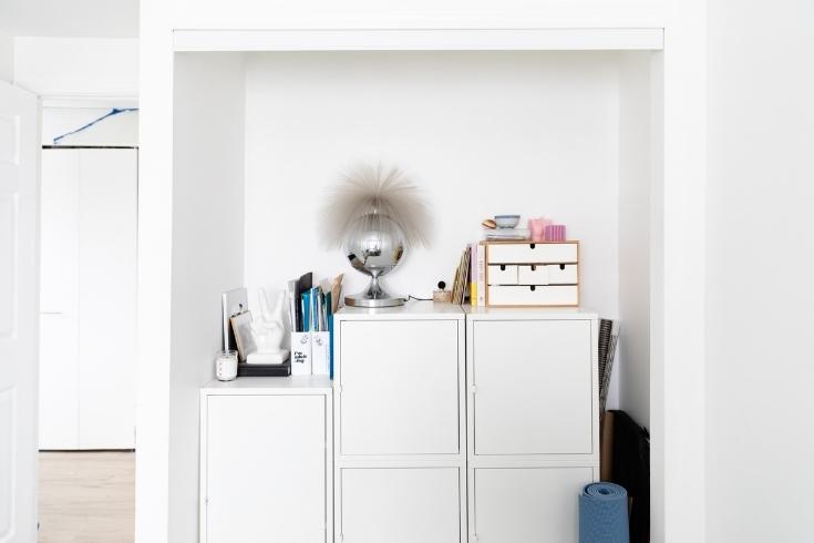 White storage cabinets stacked along a wall in the office
