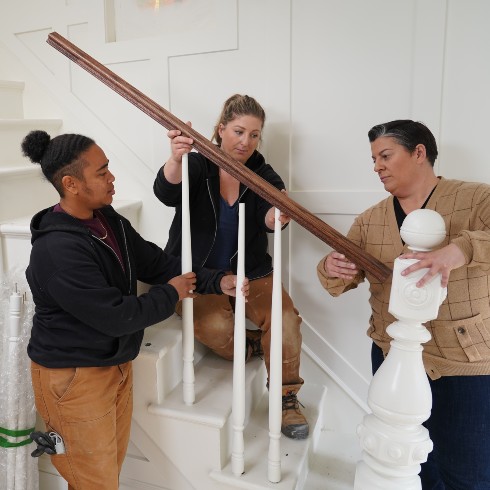 Mandy Renehan and her apprentices installing a stair railing