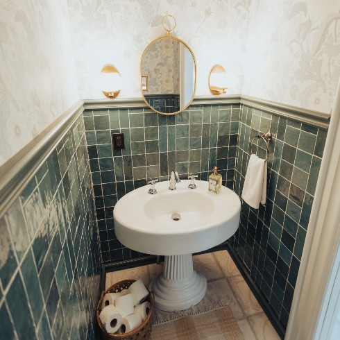 Powder room with green art deco tile