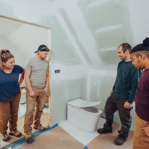 Mandy Renehan's team install a new toilet