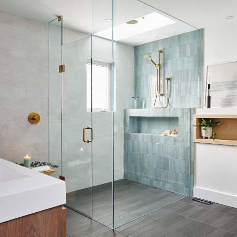 Modern glass shower with light blue show tiles