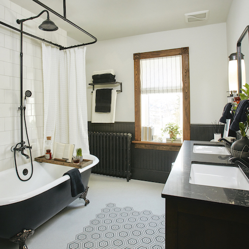 HGTV experts Mia Parres and Sherry Holmes designed this bathroom with a show-stopping classic clawfoot bathtub, an industrial-inspired waterfall shower and matte hexagon tiles for TV show Home to Win: For the Holidays