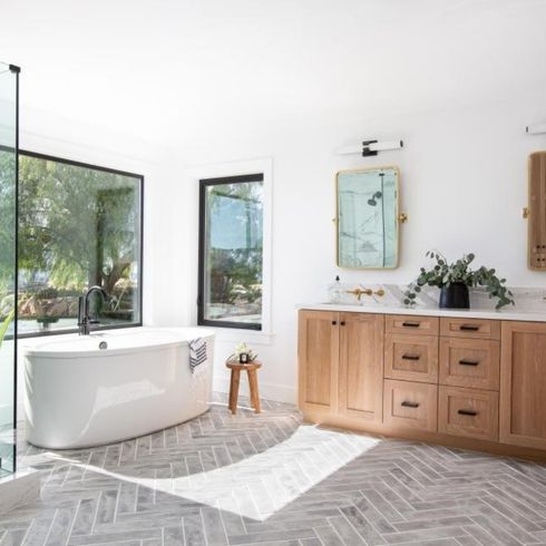 Modern bathroom with big picture windows with black casing
