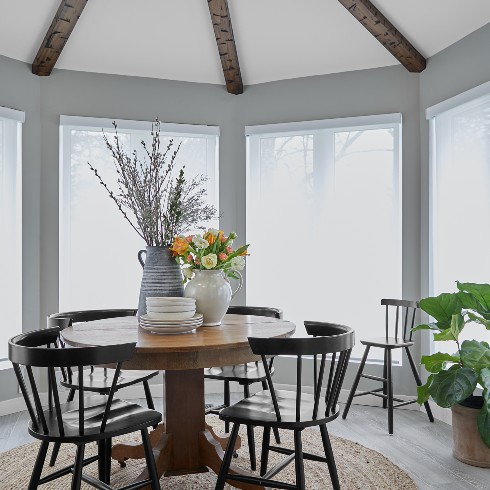 Dining room with exposed beams