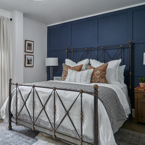 Bedroom with blue paneled feature wall