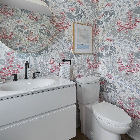 Powder room with cheerful wallpaper