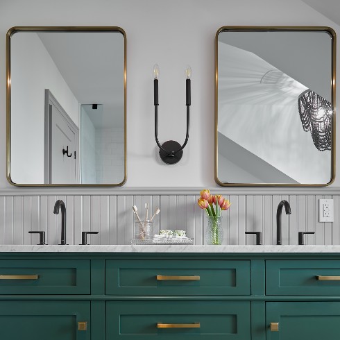 Farmhouse bathroom with a double sink and dark green vanity