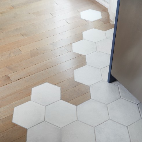 Honeycomb tile transition to hardwood