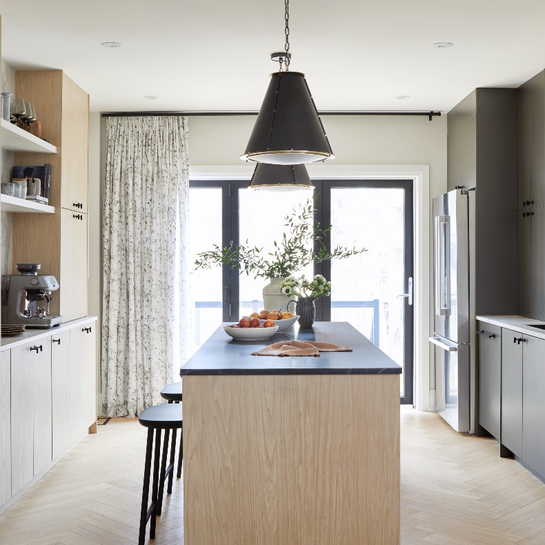Galley kitchen with island and drum pendant lights