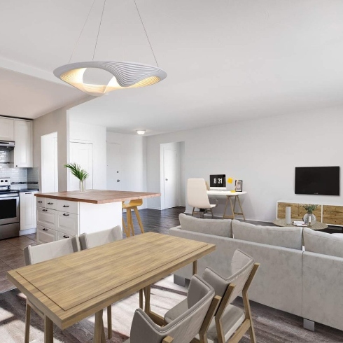 A large, bright open concept living, dining and kitchen area with sofa, TV, dining table and kitchen island