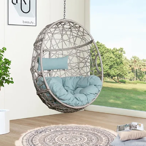 A baseless egg chair hanging indoors