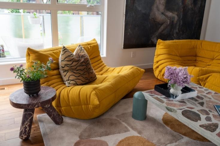 two bright yellow ribbed floor loveseat sofas