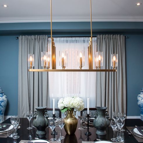 Elegant blue dining room with modern chandelier