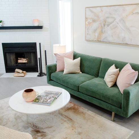 Modern living space with stylish green sofa