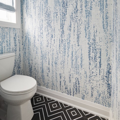 Water closet with blue wallpaper