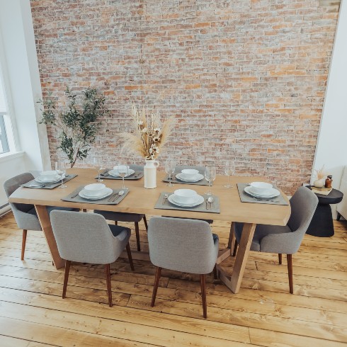Airy dining room with exposed brick