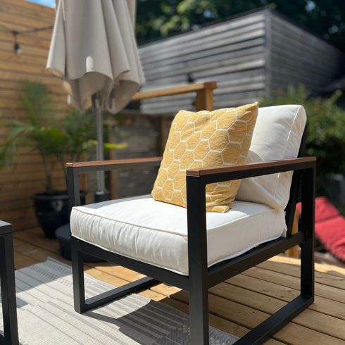 Contemporary patio chair with white cushions