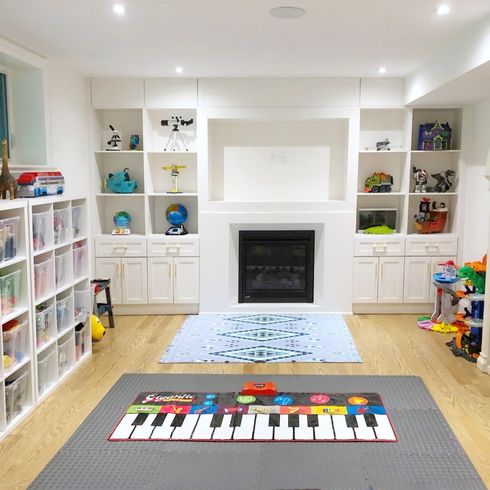 Basement playroom with built-in shelvingF