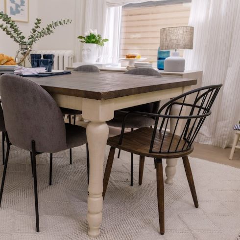 Wood dining table with mismatched chairs