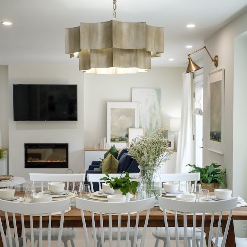 Large dining table with an abstract light fixture