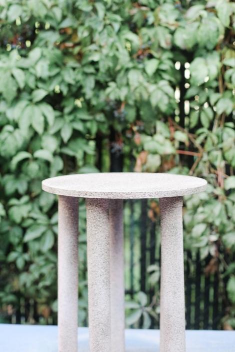 A chic terrazzo style side table outdoors