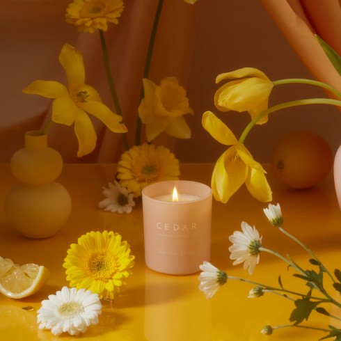 Organic fall-scented candle with yellow flowers