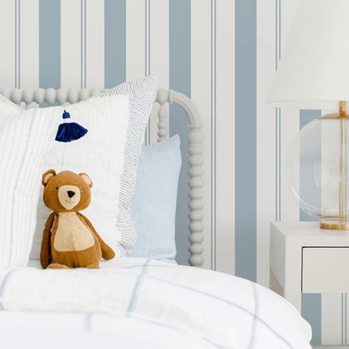 Blue and white striped wallpaper in kid's bedroom