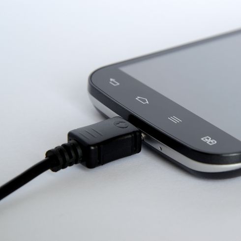 a black cellphone charging